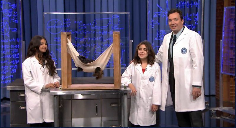 Two students with Jimmy Fallon on the Tonight Show with their invention " The Peticure".