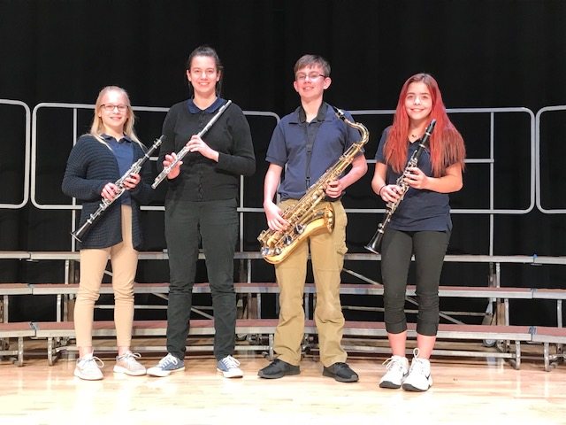 Four students with their instruments
