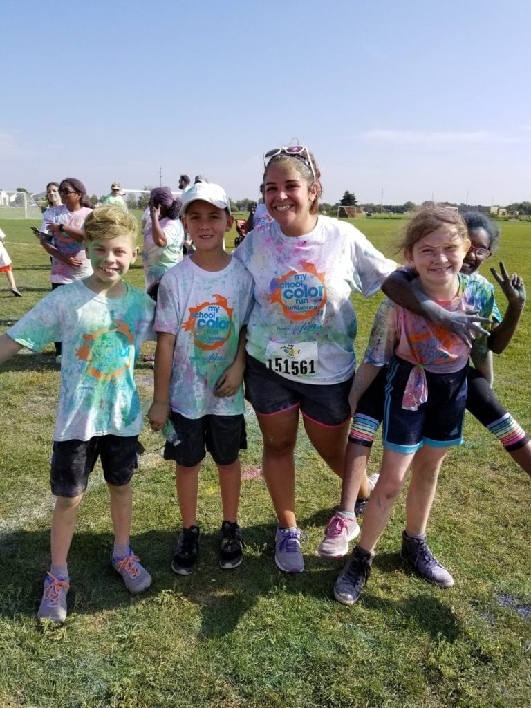 Teacher and students at the school's color run