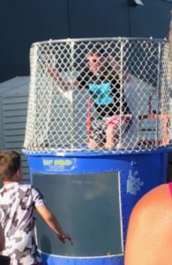Mr. Slechta in the dunk tank during the 2018 Spring Carnival