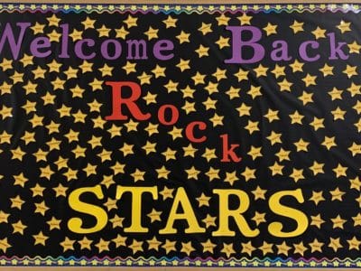 Welcome Back Rock Stars bulletin board with yellow stars and student names