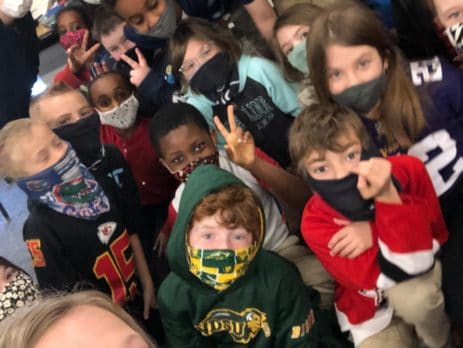 Third graders from Ms. Palecek's class celebrating Sports Wear Day as part of their Dollars for DaVinci rewards.