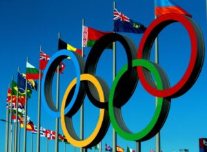 a picture of world flags and the Olympic rings